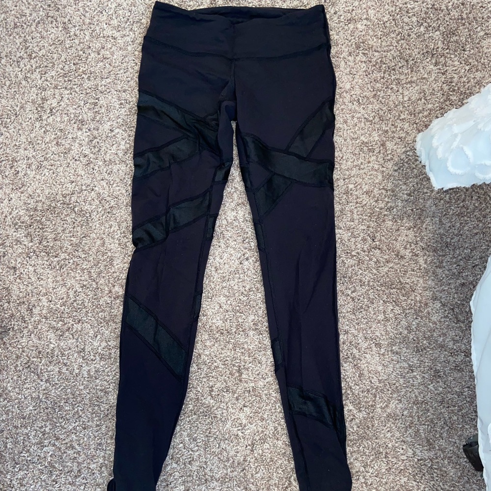 Black Lulu Lemon leggings with ankle / foot holds